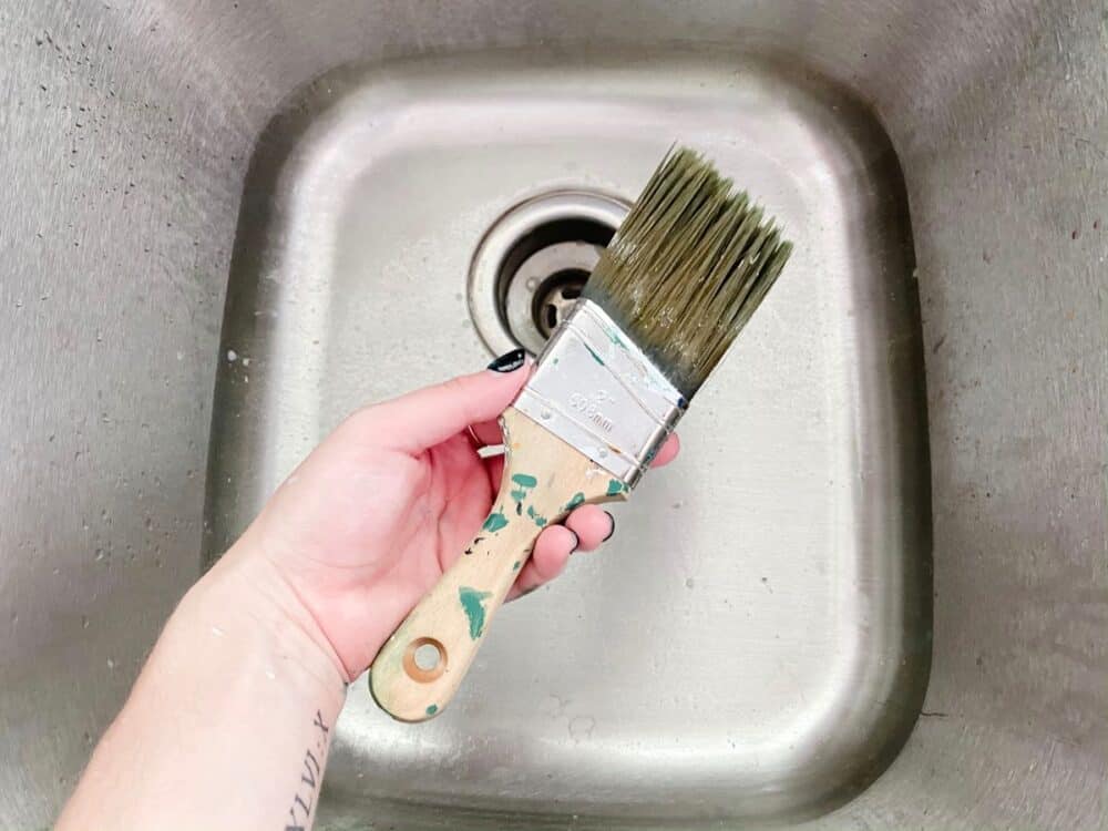 cleaning a paintbrush with white spirit