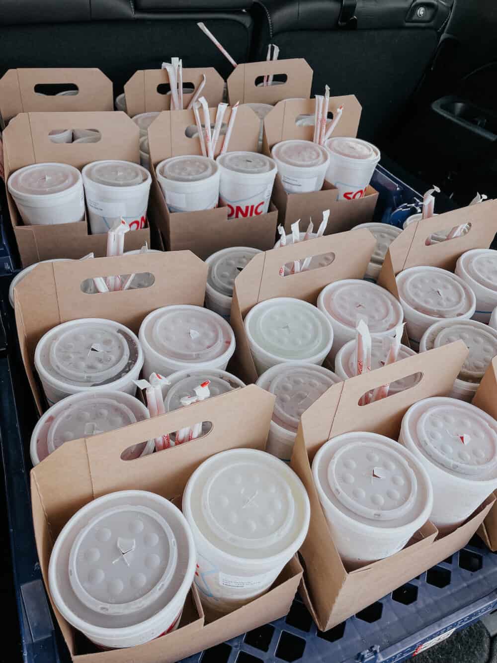 sonic drinks loaded in the back of a vehicle