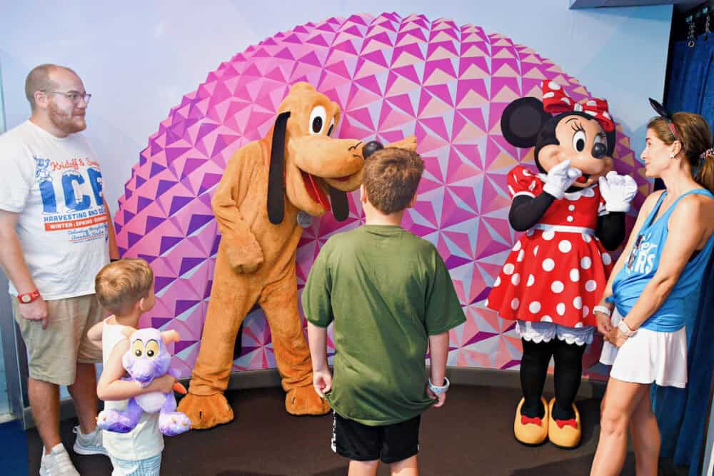 family meeting Minnie and Pluto in EPCOT