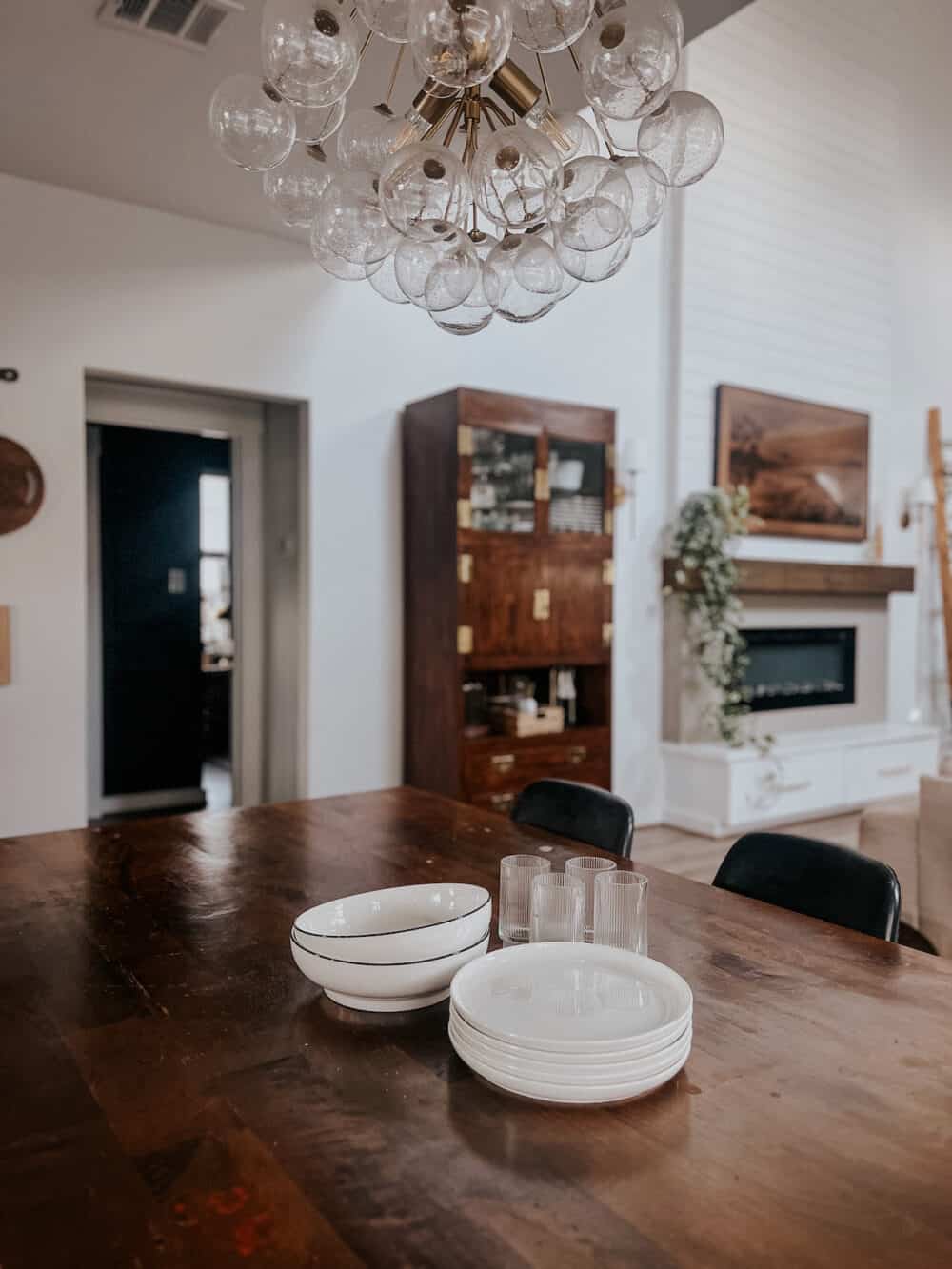 tableware being used as centerpiece on a dining room table