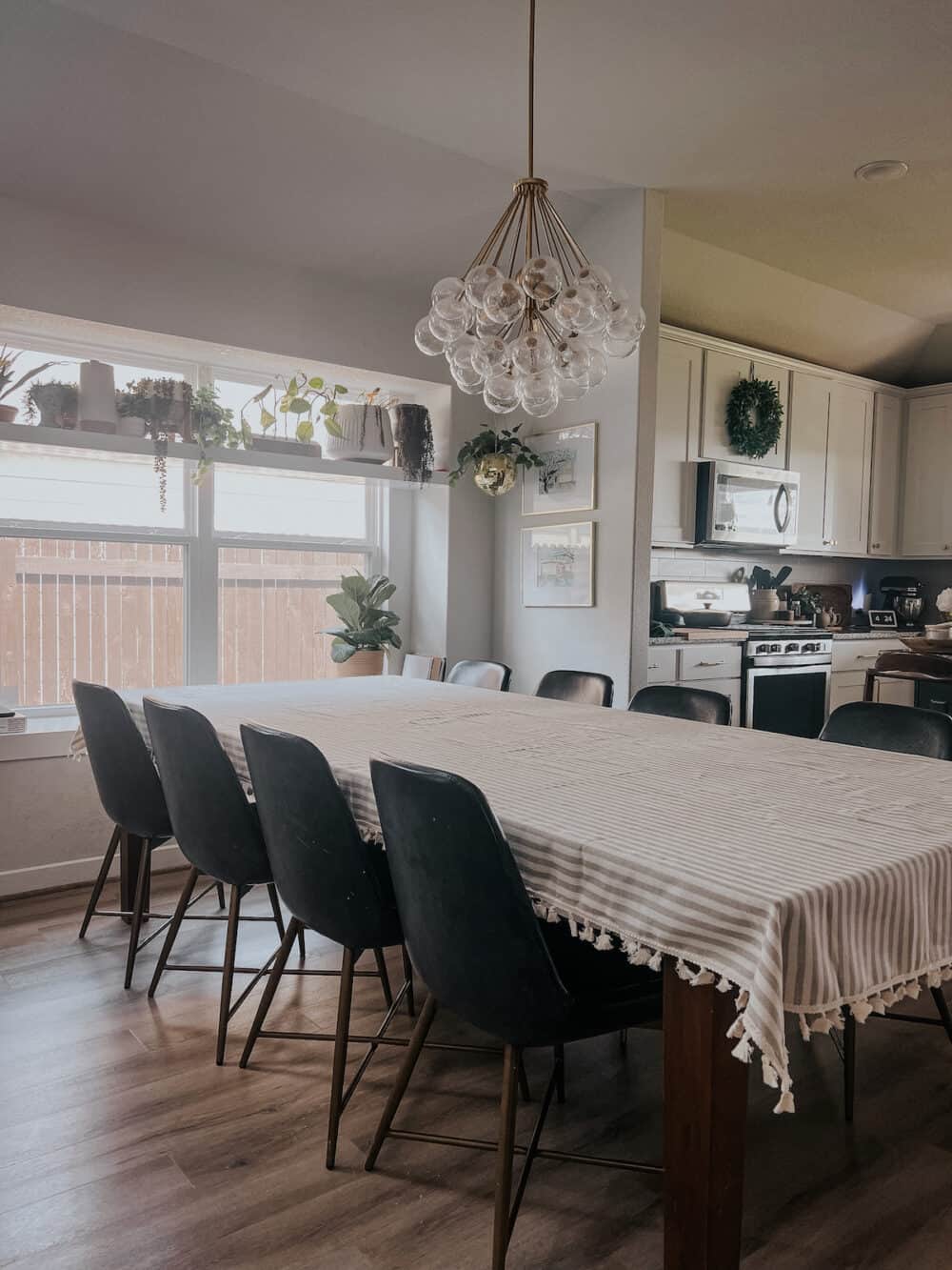 large dining room table with a striped tablecloth