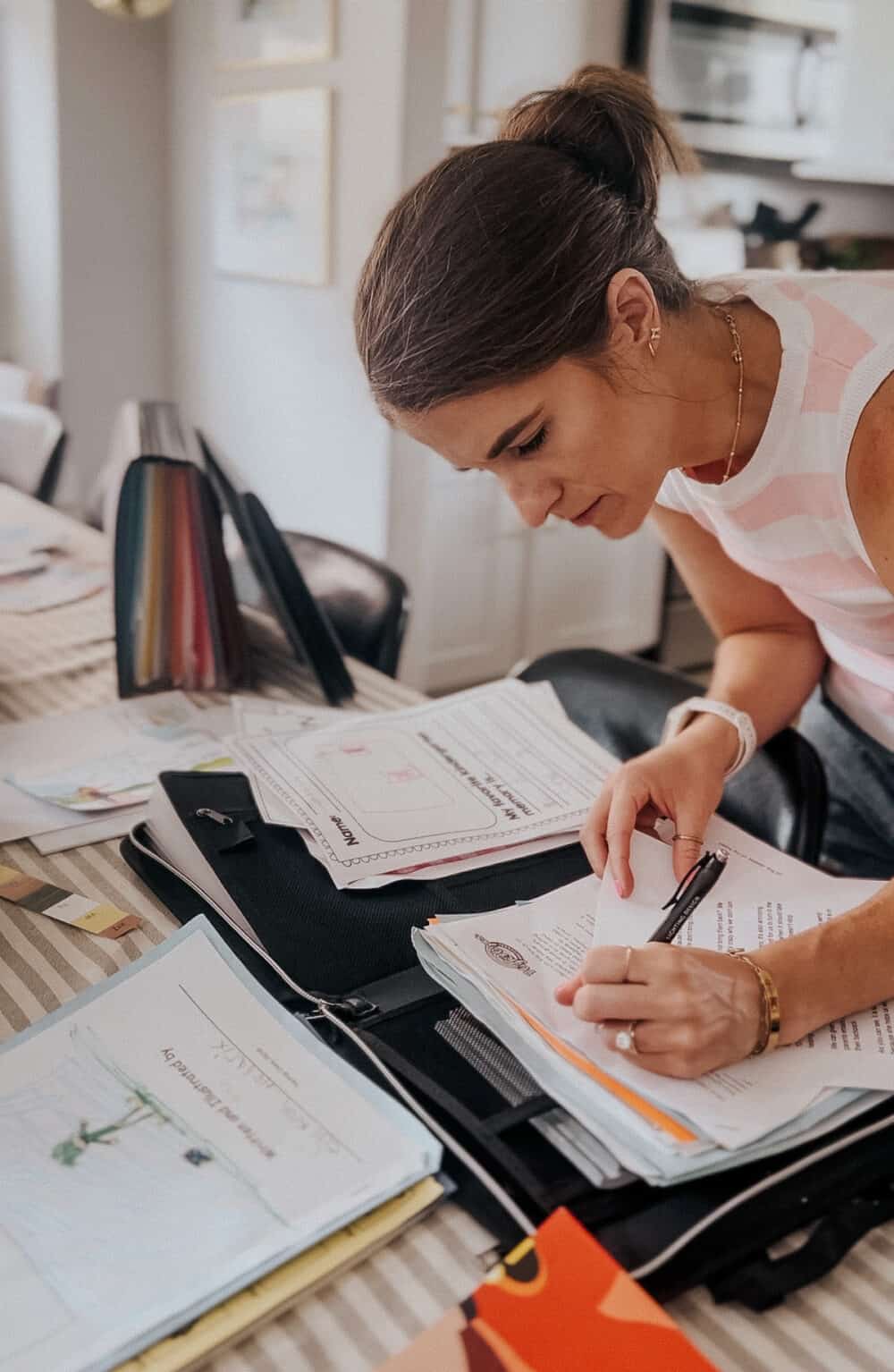 woman organizing paper clutter 