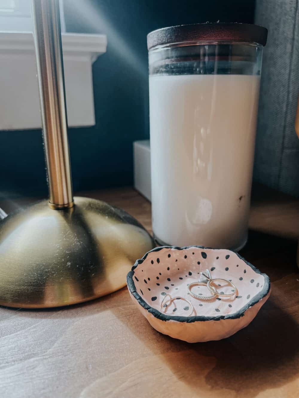 a small diy clay pinch pot on a nightstand