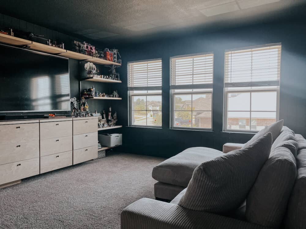 A cozy bonus room with a green painted ceiling