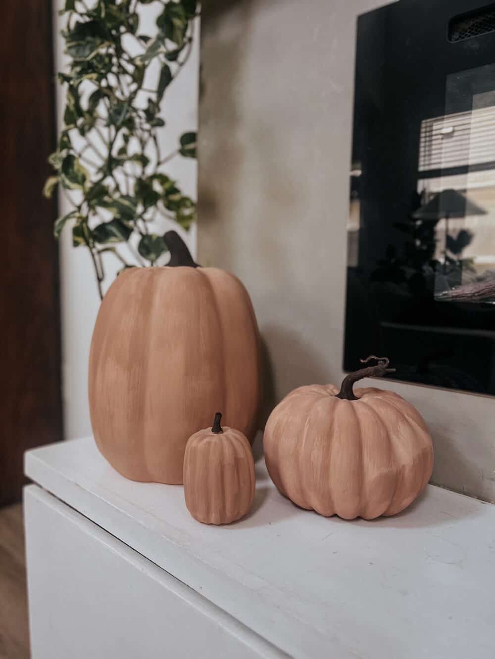 close up of DIY faux terra cotta pumpkins 