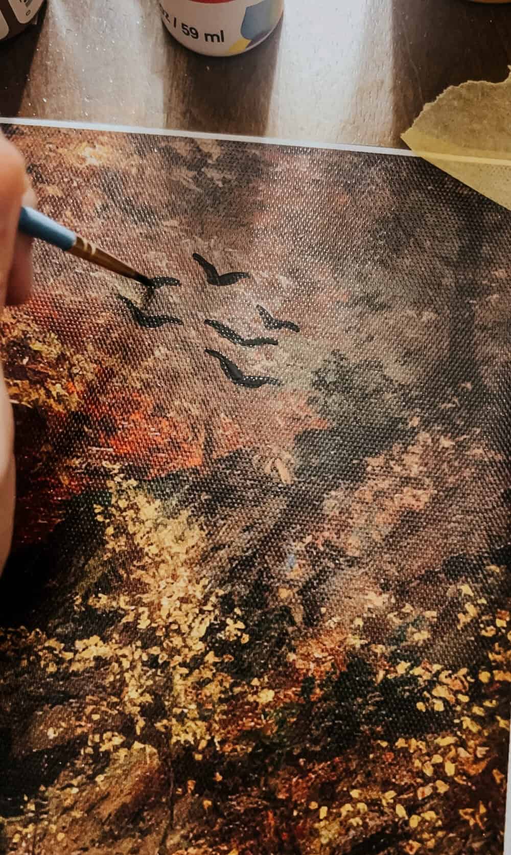 hand painting bats on a canvas print