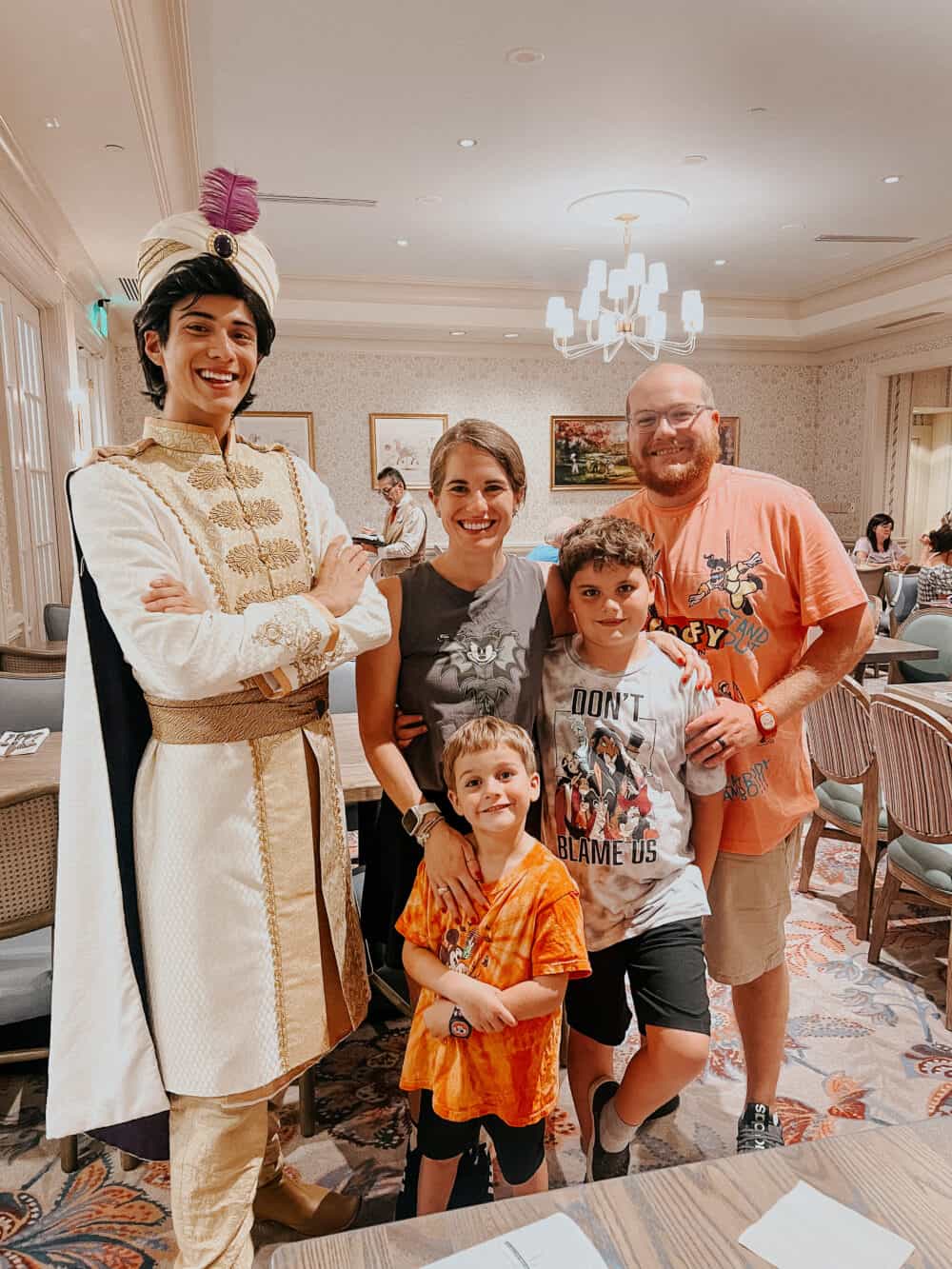 family posing with Prince Ali at 1900 Park Faire