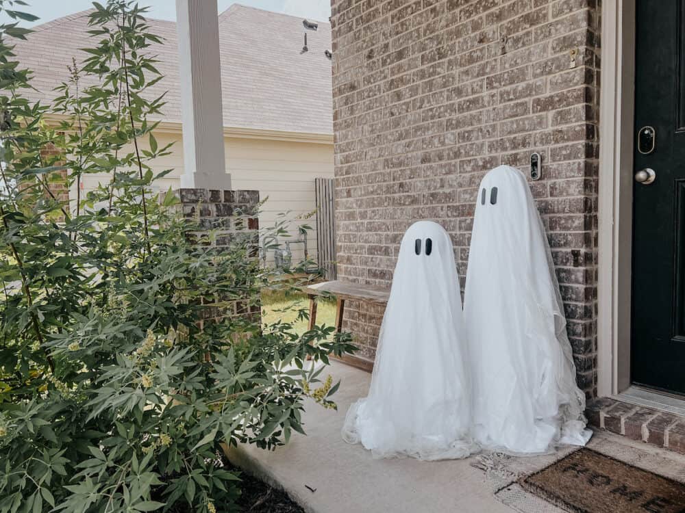 front porch with ghosts made out of tomato cages