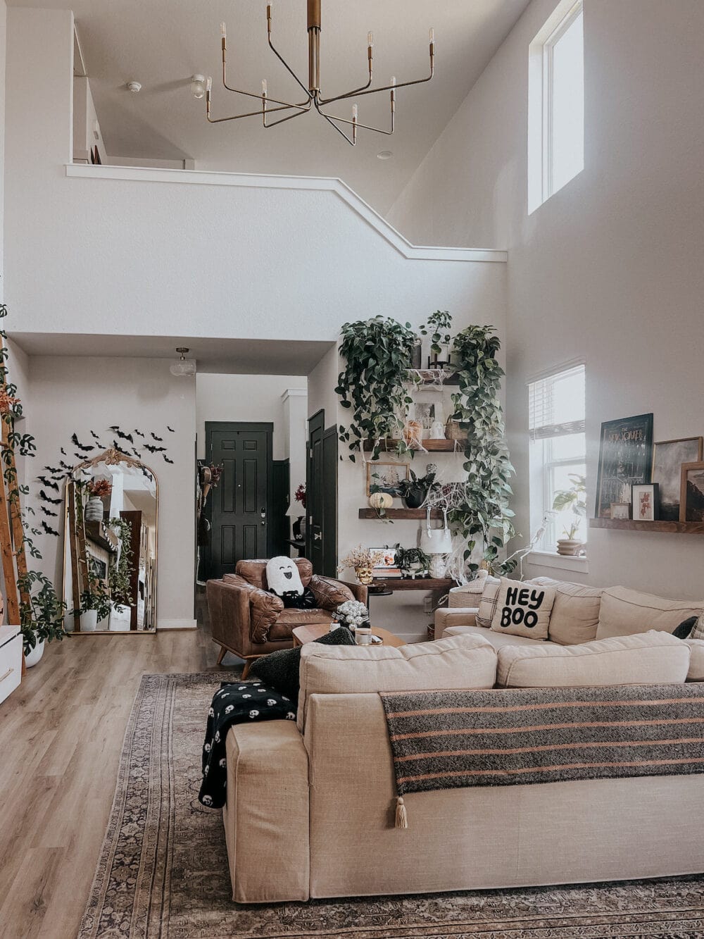 home with an open living room floor plan decorated for halloween