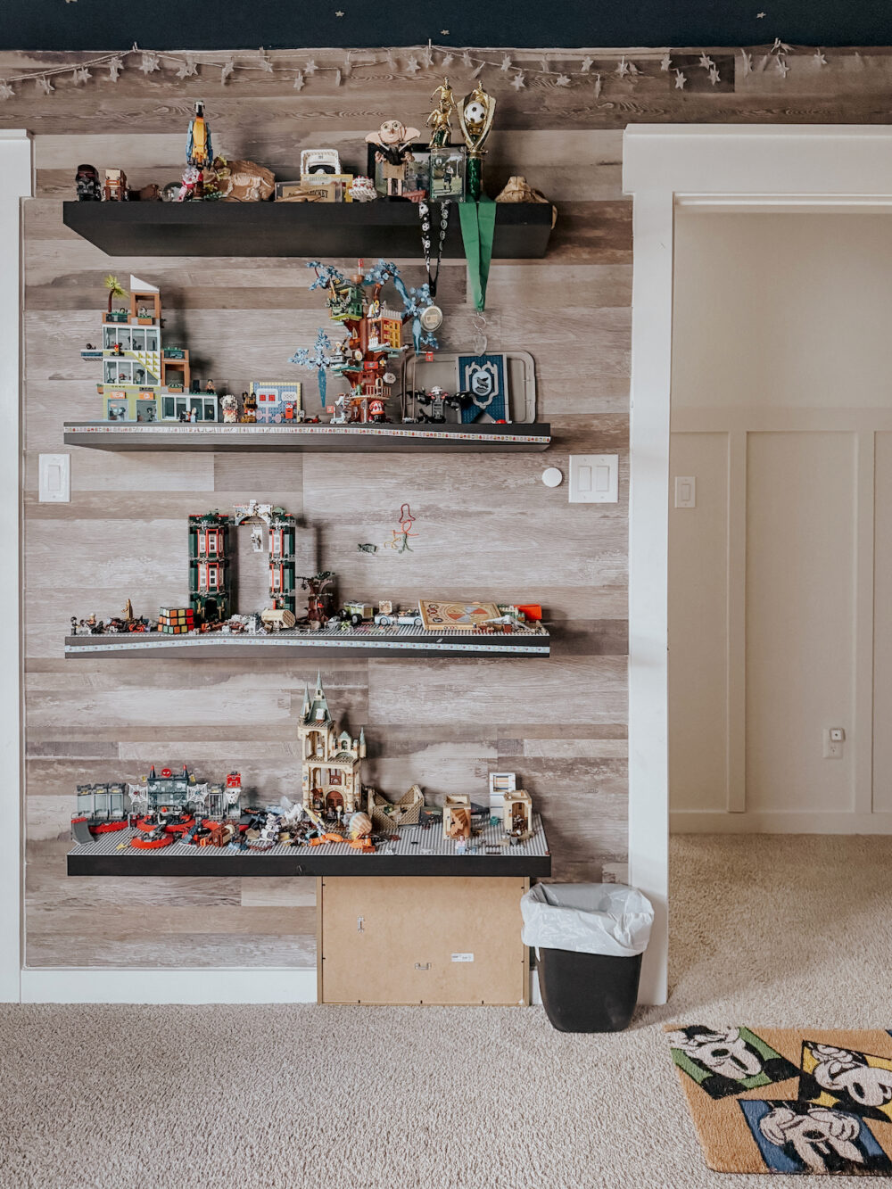 kid room with LEGO display shelves